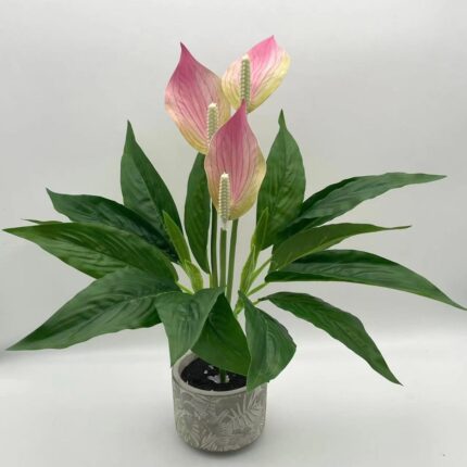Fleurs artificielles en pot de plantes vertes